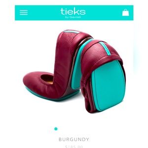 Burgundy Tieks, like new, size 8, with flower, box and bags